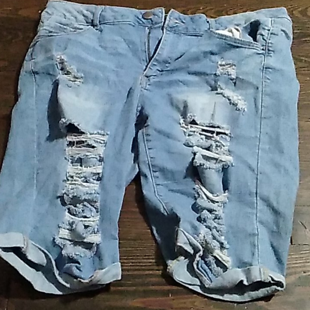 Ripped blue jean shorts